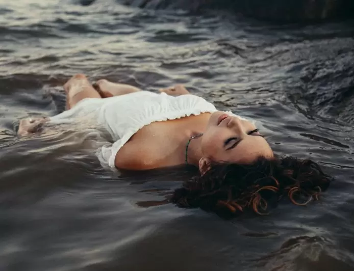 There is a unique and captivating beauty when a woman enters the water